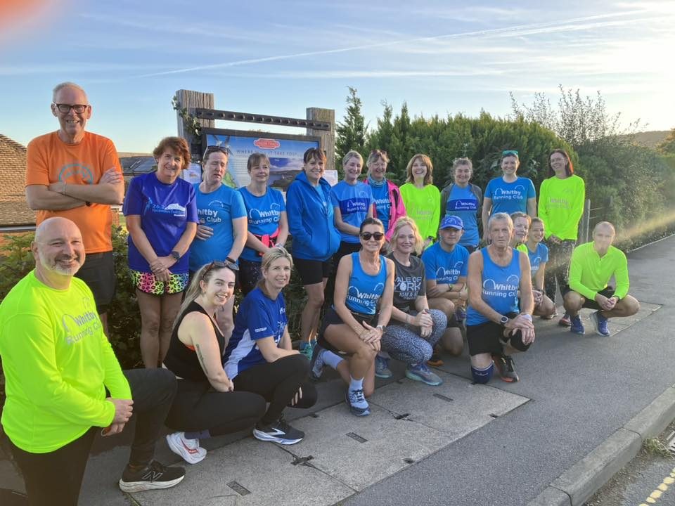 Whitby Running Club Group of friendly Whitby Running Club runners, posed outdoors on a sunny day.
